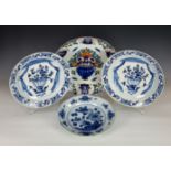 Four 18th century Dutch Delft tin glaze plates and chargers, including a pair of small chargers with