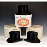 Two boxed moleskin top hats by The Tween Hat Company, retailed by E P Falle Jersey, together with