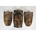 Tribal Art - a collection of three Nigerian tribal masks, probably early to mid-20th century, each