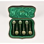 A cased set of six Edwardian silver gilt anointing spoons, Edward Barnard & Sons Ltd, London 1901,