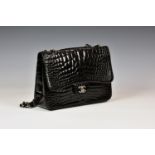 Chanel - a black alligator Jumbo flap bag, c. 2010, with single outside pocket, silver hardware