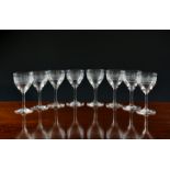 A set of eight Victorian wine or port glasses, the cup bowls with comb cutting below a lattice cut