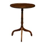 A 19th century mahogany tilt-top tripod table, the dished circular top on a turned column and