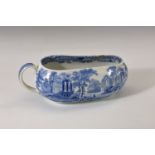 A late 18th or early 19th century blue and white transfer printed Bourdalou, boat form with c-scroll