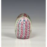 A Murano glass paperweight, mid-20th century, ovoid form, with pink, blue and white flowers and