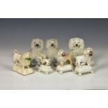 Seven 19th century Staffordshire models of Poodles, comprising a hunting Poodle with bird in