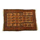 A Persian prayer rug, on tan ground with orange and blue detail, 45 x 30¾in. (114.3 x 78.1cm.).