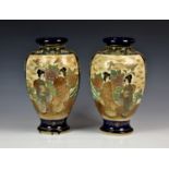 A pair of Japanese Satsuma vases, baluster form, painted with figures in a floral landscape on