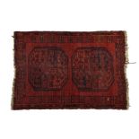An Ersari Turkmen two Gulli Gul rug, on red ground and two central octagonal Gulli Guls and borders,