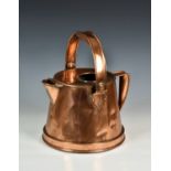 A Victorian copper water jug, with swing carry handle, 14in. (35.5cm.) to top of handle, faults.