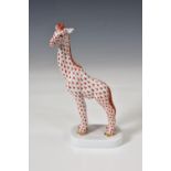 A Herend porcelain Giraffe, hand painted in Vieux Herend (VHR) red fish scale design, blue factory