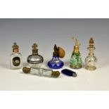 A group of vintage scent bottles, including a Victorian cut glass double ended scent with brass