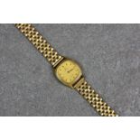A ladies Omega De Ville 9ct gold bracelet watch, ref. 1387, the 17mm. rounded square dial with black
