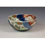 A Japanese porcelain Imari punch bowl, Meiji period (1868-1912), painted with alternate panels of