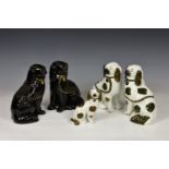 A group of five 19th century Staffordshire dogs, comprising a pair in black glaze with gilt