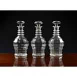 A set of three Joseph Inwald 'Jacobean' mould blown glass decanters, early 20th century, with