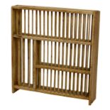 A pine plate rack, in four sections with spindle dividers, 36 x 8½in. (91.4 x 21.5cm.), 38½in. (97.