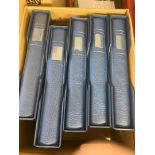 STAMPS Five Lindner 18 ring luxury blue binders, each with a matching slip case.