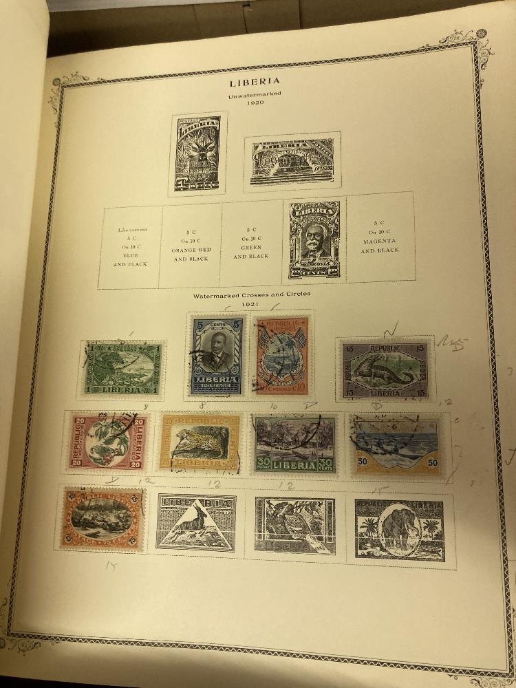 STAMPS : WORLD, two large Scott printed albums, each with a splattering of mint and used stamps. - Image 3 of 4