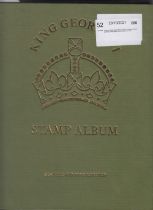 STAMPS : George VI Green Crown album with a few stamps included,