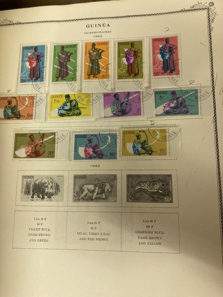 STAMPS : WORLD, two large Scott printed albums, each with a splattering of mint and used stamps. - Image 4 of 4