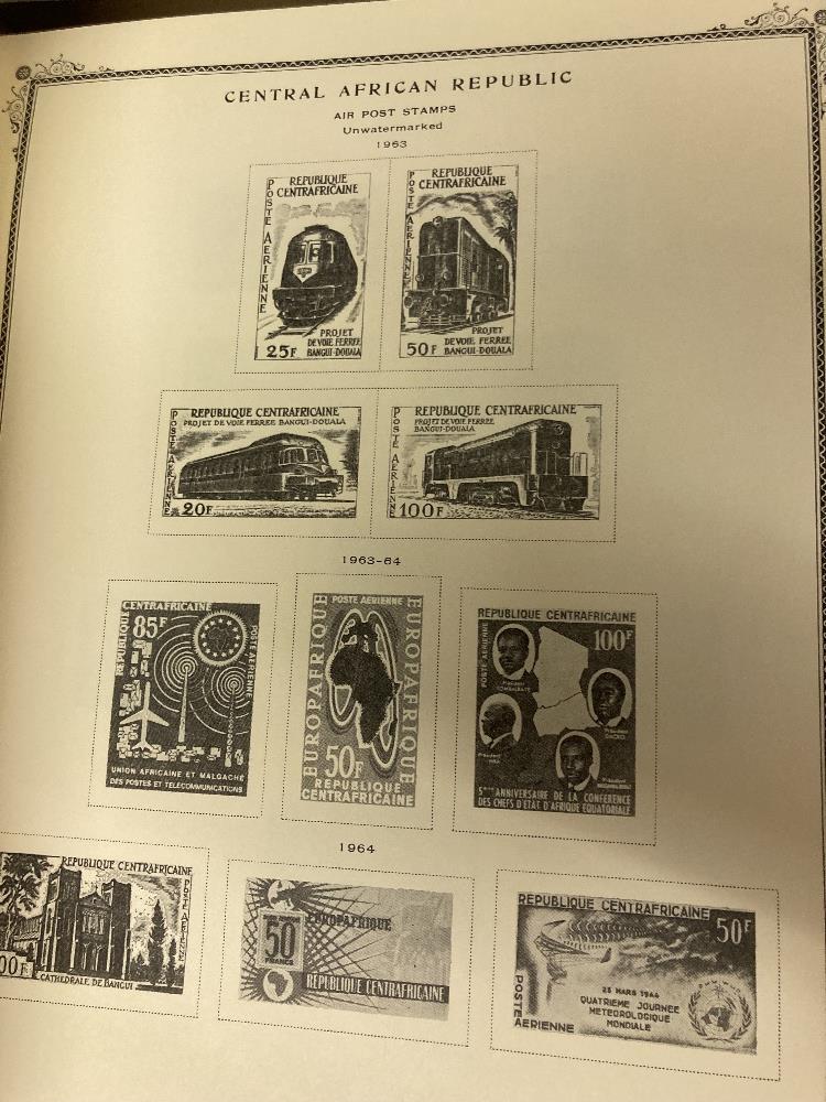 STAMPS : WORLD, two large Scott printed albums, each with a splattering of mint and used stamps. - Image 2 of 4