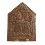 A COPPER REPOUSSE PLAQUE DEPICTING TWIN DEITIES, INDIA, 19TH CENTURY