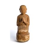 A SANDSTONE FIGURE OF A BUDDHIST DEVOTEE, BURMA (NOW MYANMAR) CIRCA 15TH CENTURY