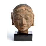 A CARVED WOOD HEAD OF A WOMAN, WESTERN INDIA, 18TH / 19TH CENTURY