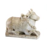 A CARVED MARBLE FIGURE OF NANDI BULL, NORTHERN INDIA, 20TH CENTURY