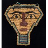 AN EGYPTIAN BEAD 'MUMMY' MASK, LATE DYNASTIC / PTOLEMAIC, CIRCA 7TH / 4TH CENTURY BC