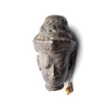 A SMALL KHMER BRONZE HEAD OF A DEITY, CAMBODIA, 12TH CENTURY