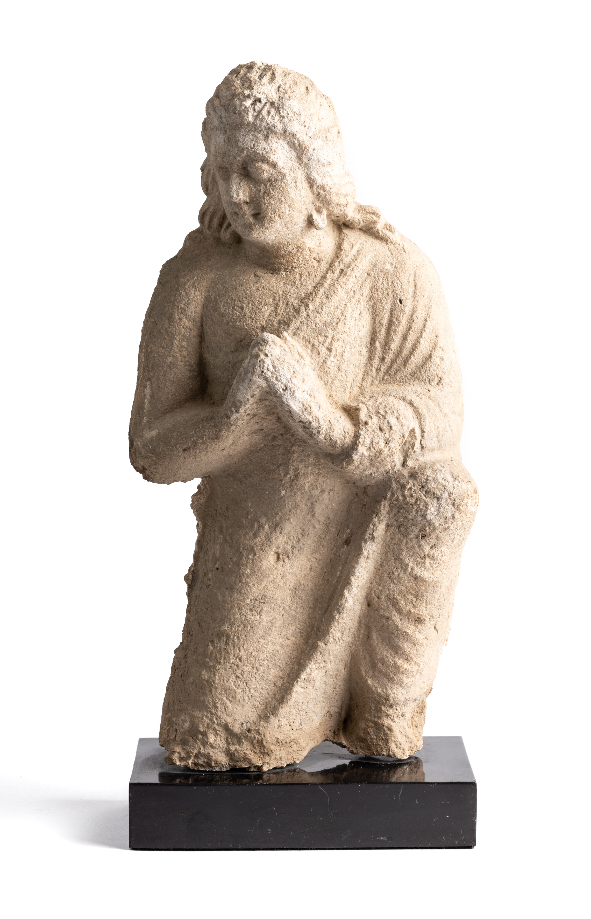 A GANDHARA STUCCO RELIEF FIGURE OF A DEVOTEE, NORTH-WEST FRONTIER REGION, INDIA (NOW PAKISTAN), 4TH/