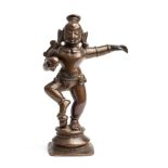 A SMALL BRONZE FIGURE OF DANCING KRISHNA, TAMIL NADU, SOUTH INDIA, 17TH/18TH CENTURY