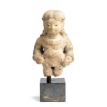 A MAJAPAHIT PUMICE FIGURE OF A BOY, POSSIBLY KRISHNA, JAVA, 14TH/15TH CENTURY