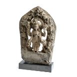 A GREY STONE STELE DEPICTING ARDHANISVARA, NEPAL, 16TH / 17TH CENTURY