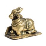 A BRASS FIGURE OF NANDI BULL, SOUTH INDIA, 16TH/17TH CENTURY