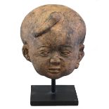 A MAJAPAHIT HEAD OF A BOY, EASTERN JAVA, CIRCA 14TH CENTURY