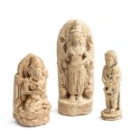 THREE SMALL PUMICE FIGURES OF DEITIES, MAJAPAHIT, JAVA, 14TH/15TH CENTURY