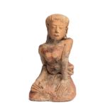 A MAJAPAHIT TERRACOTTA FIGURE OF A KNEELING MAIDEN, JAVA, CIRCA 14TH CENTURY