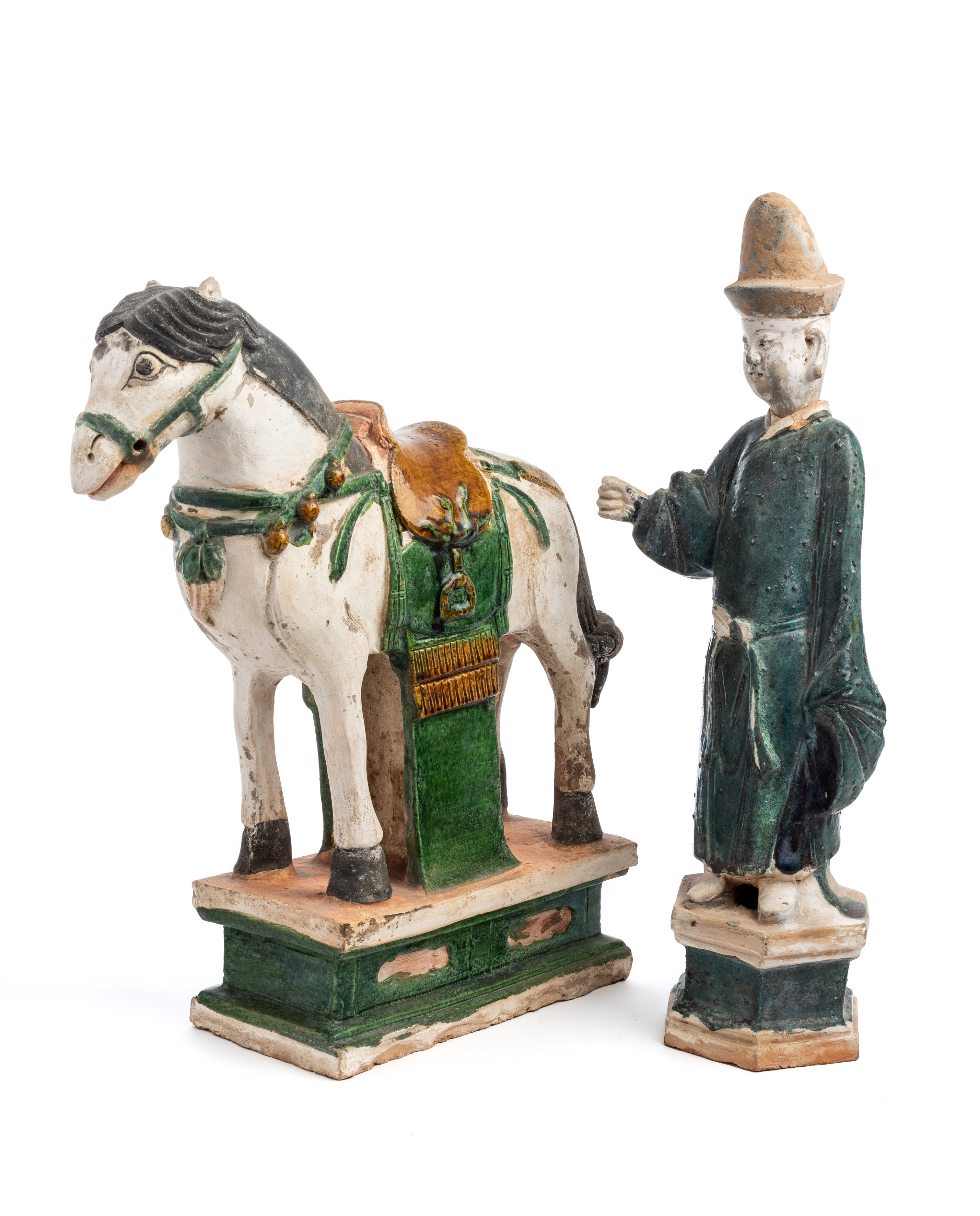 A CHINESE SANCAI GLAZED POTTERY HORSE AND A GROOM, MING STYLE