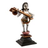 A FIGURE OF A CELESTIAL MUSICIAN, GOA, 19TH CENTURY