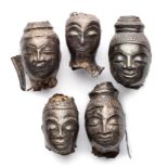 FIVE SMALL SHEET SILVER HEADS OF BUDDHA, THAILAND, CIRCA 18TH CENTURY