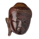 A FRAGMENTARY GILT-LACQUER HEAD OF BUDDHA, BURMA, 18TH/19TH CENTURY
