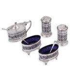A CASED FIVE-PIECE SILVER CONDIMENT SET, HASELER & BILL OF BIRMINGHAM, CHESTER, 1920/21