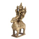 A BRONZE FIGURE OF SIVA AND PARVATI RIDING ON NANDI BULL, WESTERN DECCAN, 19TH CENTURY