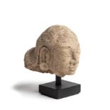 A SMALL PUMICE HEAD OF A MAIDEN, MAJAPAHIT, JAVA, CIRCA 14TH CENTURY