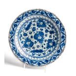 A LARGE IZNIK BLUE AND DISH, OTTOMAN ANATOLIA, FIRST HALF 17TH CENTURY