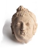 A GANDHARA STUCCO HEAD OF BUDDHA, NORTH-WEST FRONTIER REGION, INDIA (NOW PAKISTAN), 4TH/5TH CENTURY