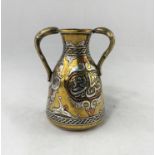 An Middle Eastern antique brass vase of traditional design, overlaid in copper and silver, 12 cm;